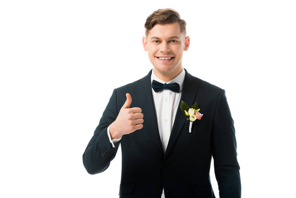 cheerful bridegroom showing thumb up isolated on white - Foto, Imagen