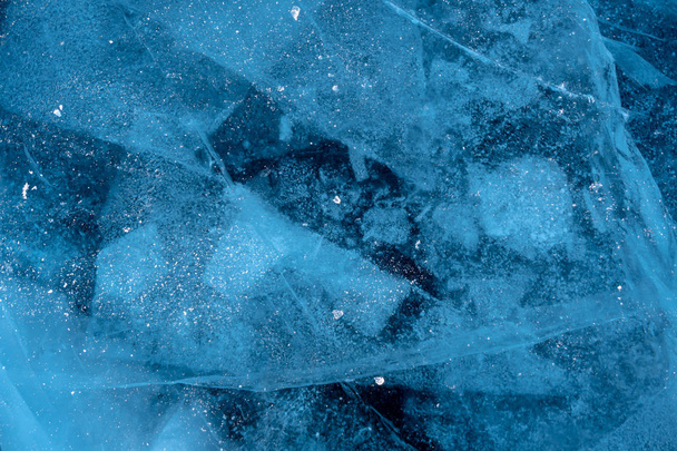 Texture of pure blue cracked ice of lake Baikal. Drawings of nature - Фото, зображення