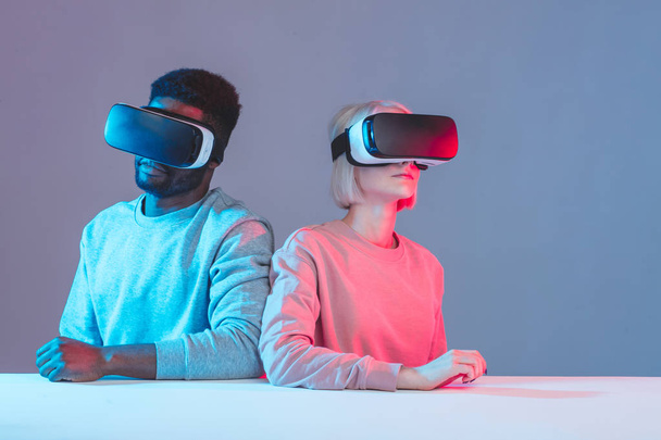 young mixed race couple having fun with VR glasses - Fotografie, Obrázek