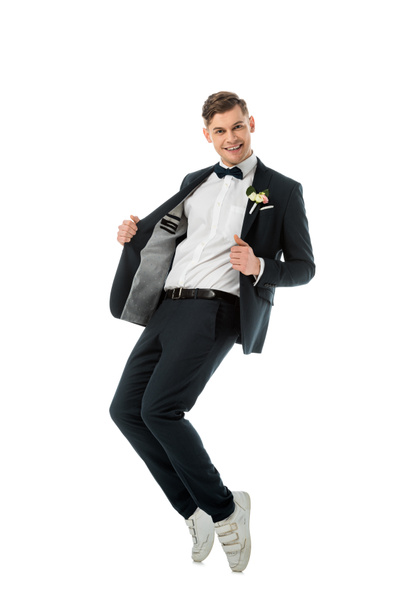 handsome excited groom dancing and looking at camera isolated on white - Φωτογραφία, εικόνα
