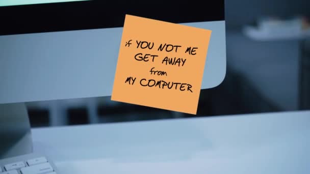 Get Away From My Computer. The inscription on the sticker on the monitor. Message. Motivation. Reminder. Handwritten text written with a marker. Color sticker. A message for an employee, a colleague - Video