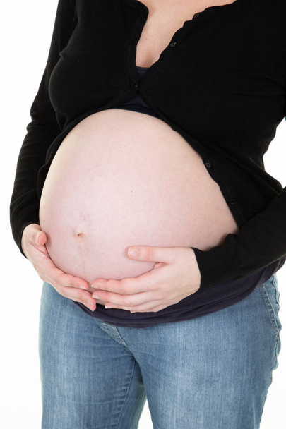 Healthy pregnancy concept pregnant woman holding her stomach - Fotoğraf, Görsel