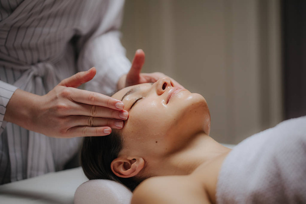 Woman Having Face Massage - Fotografie, Obrázek