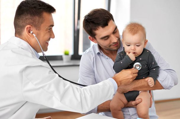 father with baby and doctor at clinic - Photo, Image