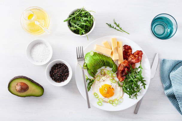 healthy keto breakfast: egg, avocado, cheese, bacon - Photo, Image