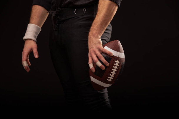 Cropped Image Of Sportsman Holding American Football Ball - Foto, Imagem