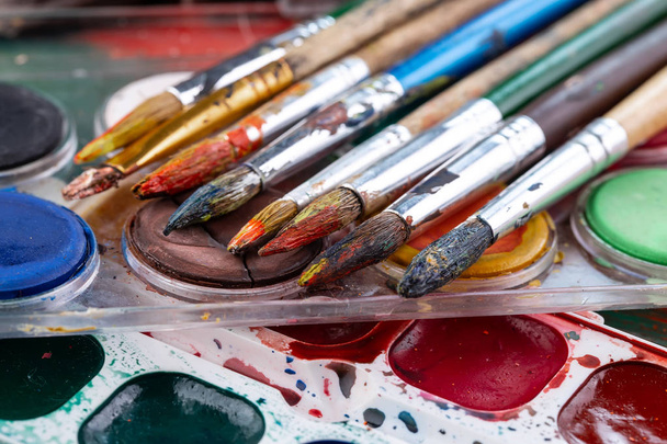 Paint brushes and paints for drawing. - Фото, изображение