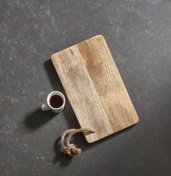 black background cutting board with  coffee - 写真・画像