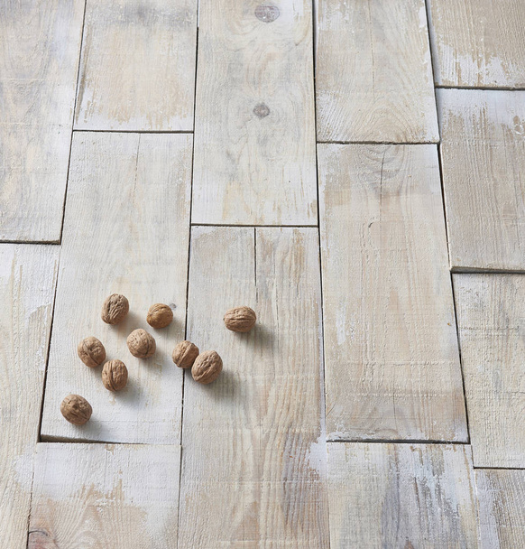 Walnuts close up  on floor background - Fotografie, Obrázek