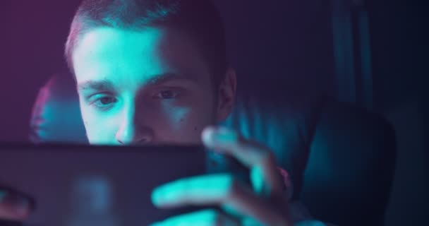 Portrait of a man playing games on a switch console - Felvétel, videó