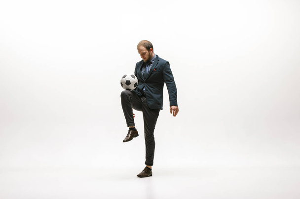 Businessman with football ball in office - Foto, imagen