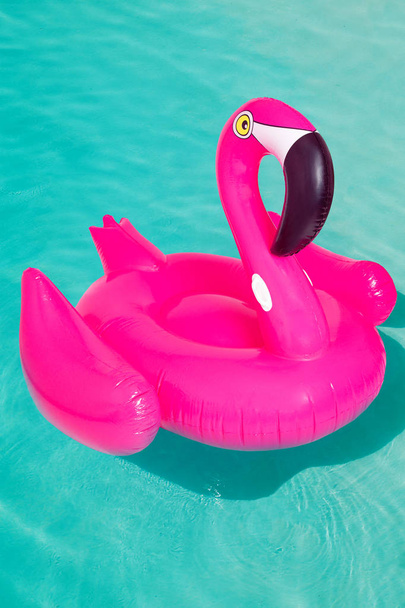3d pink flamingo, tropical bird shape inflatable swimming pool ring, tube, float. Summer vacation holiday rubber object, traveling, beach ocean. Illustration isolated blue background - Fotoğraf, Görsel