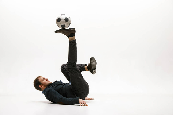 Businessman with football ball in office - Fotoğraf, Görsel