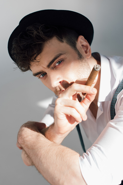 serious handsome man with cigar looking at camera - Foto, Imagem