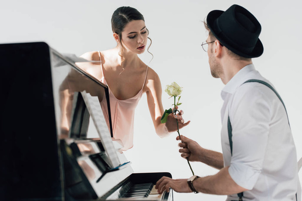beautiful musician gifting rose to beautiful ballerina
  - Фото, изображение