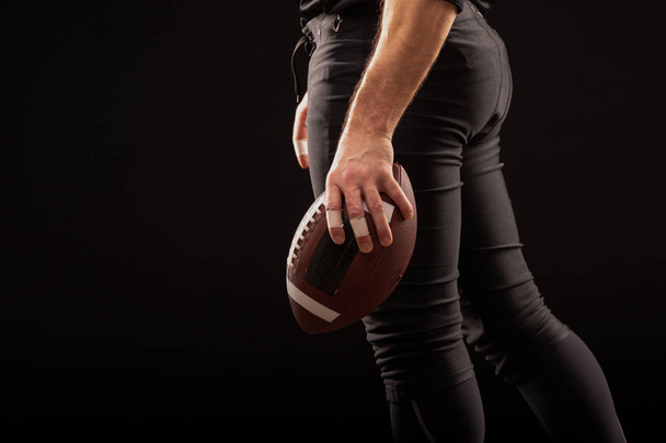 Cropped Image Of Sportsman Holding American Football Ball - 写真・画像