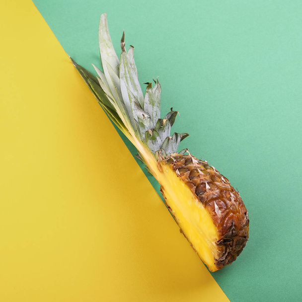 Pineapple half on bright background creative layout, copy space. - Foto, imagen
