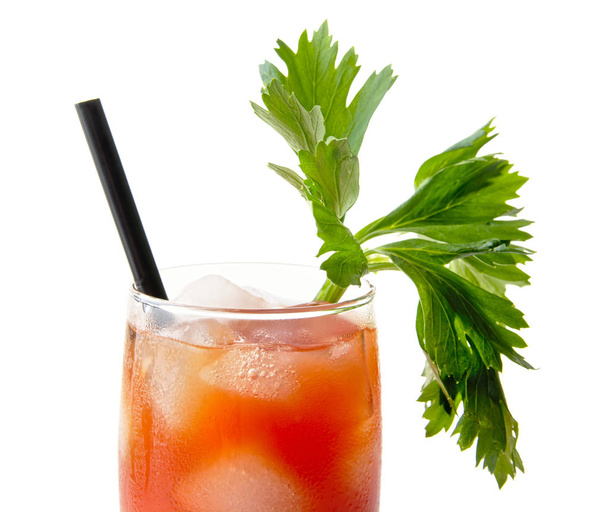 Close-up of bloody mary with ice cubes with celery on white - Zdjęcie, obraz