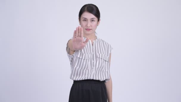Serious asiático businesswoman mostrando stop gesture
 - Imágenes, Vídeo