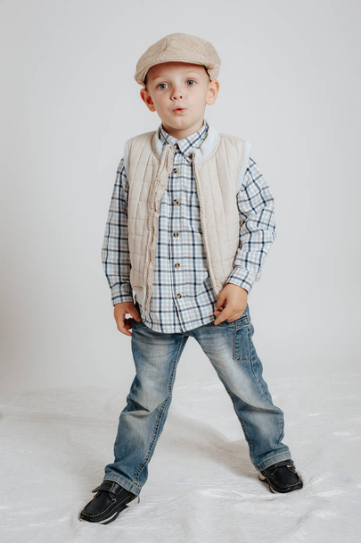 Little boy in a cap posing - Фото, изображение