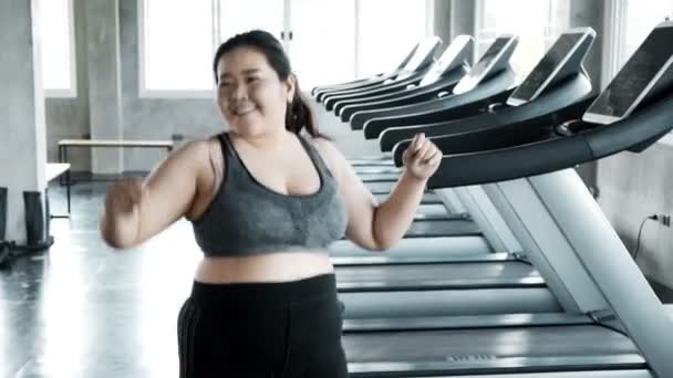 Young plus size start dancing in gym full of happiness. Happy plus size fitness lifestyle concept.  - Filmati, video