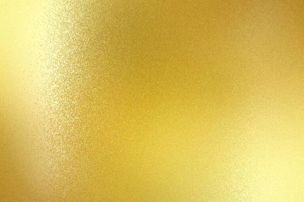 Glanzend geborsteld goud metalen paneel, abstracte textuur achtergrond - Foto, afbeelding