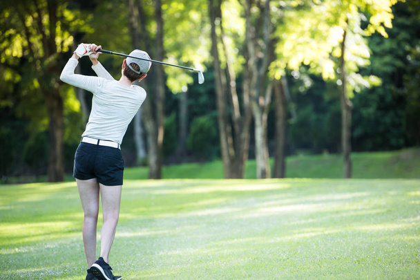 Asian woman playing golf on a beautiful natural golf course - Photo, Image
