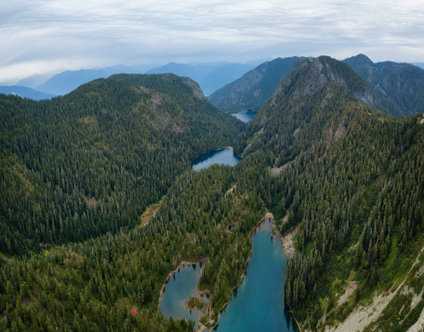 Aerial view of Brunswick Lake and Hanover Lake surrounded by the beautiful Canadian Mountains. Taken near Squamish, North of Vancouver, BC, Canada. - Foto, Bild