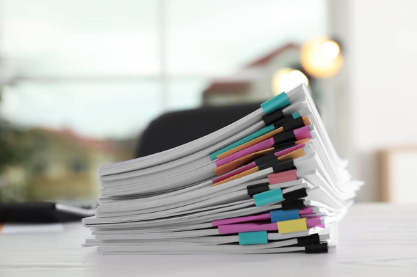 Stack of documents with paper clips on office table - Photo, image