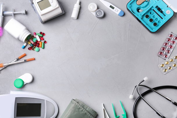 Flat lay composition with medical objects and space for text on grey background - Photo, Image