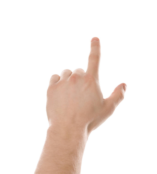 Mies osoittaa jotain valkoisella taustalla, lähikuva kädestä
 - Valokuva, kuva