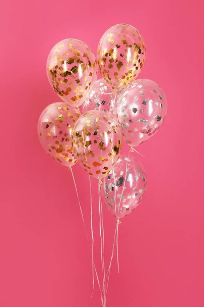 Bunch of bright balloons on color background - Fotó, kép