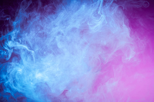 Blue cloud of smoke of  pink isolated background. Background from the smoke of vap - 写真・画像