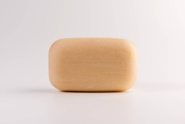 piece of beige soap isolated on a white background - 写真・画像