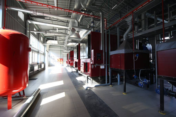 Wide-angle panoramic photo of the newest alternative fuel boiler room with pipes, towers and tanks, on a clear summer day, without people - Photo, Image