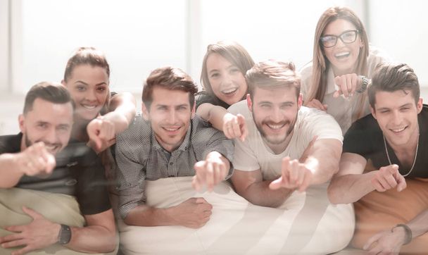 happy business team pointing at you. - Foto, Imagem