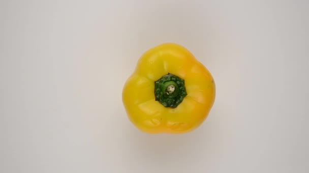 Yellow Pepper Against White - Overhead Dolly Left - Footage, Video