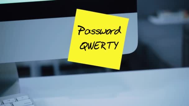 Simple, easy password. Qwerty. 1234567. Computer security. Account hacking. Password on the monitor. Handwritten text written with a marker. Color sticker. A message for an employee, a colleague - Footage, Video