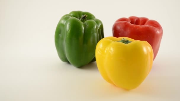 Yellow, Green and Red Peppers Against White - Triangle Arrangement - Dolly Left - Footage, Video