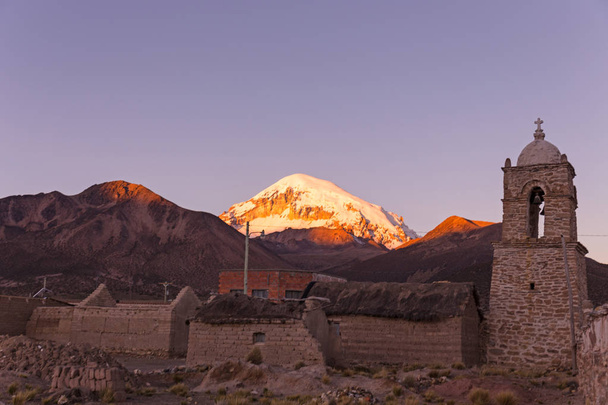 Dusk in the small Andean town of Sajama, with the Sajama volcano - Photo, Image