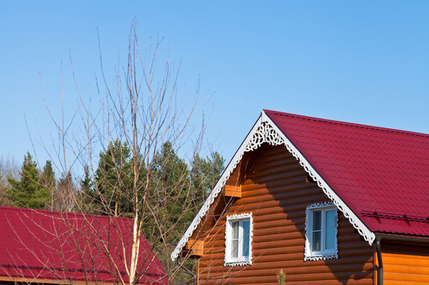 red tile roofs of new wooden houses - Photo, Image