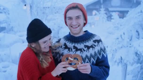 couple has fun in winter forest, runs and laughs - Video