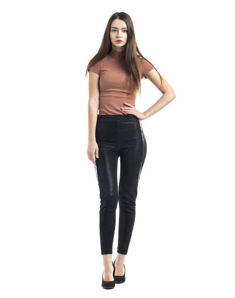 Full body, Young beautiful brunette woman in black pants - Foto, imagen