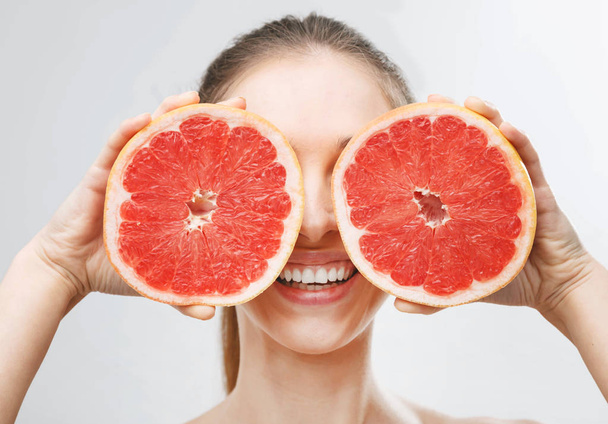 Woman with Grapefruit - 写真・画像