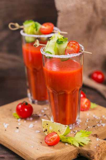 Two glasses of tomato juice decorated with fresh tomatoes, cucum - Foto, Imagem