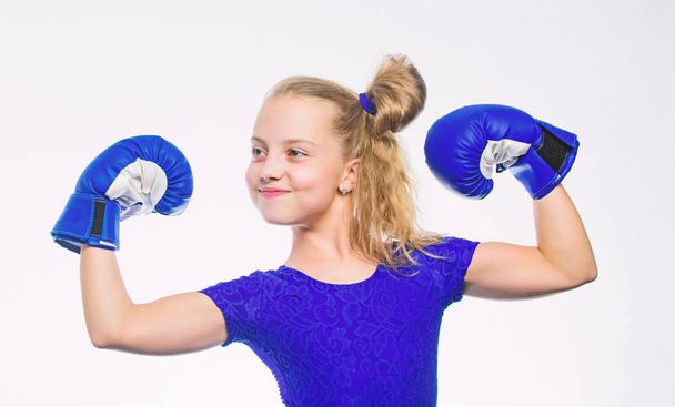 Sport and health concept. Boxing sport for female. Be strong. Girl child with blue gloves posing on white background. Sport upbringing. Upbringing for leadership and winner. Strong child boxing - Foto, Bild