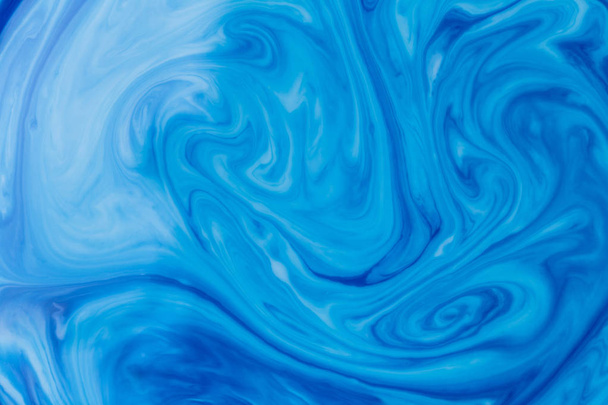 Blue liquid ink swirl abstract background - Foto, afbeelding