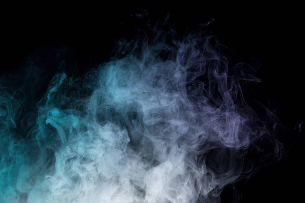 Colorful smoke on black background - Foto, afbeelding