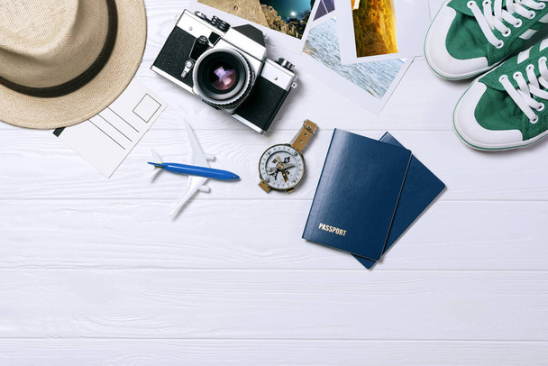 Traveler's accessories, Overhead view of essential vacation items, Travel concept background - Fotó, kép