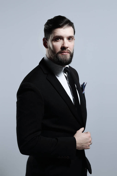 portrait of a confident businessman.isolated on grey background - Fotografie, Obrázek